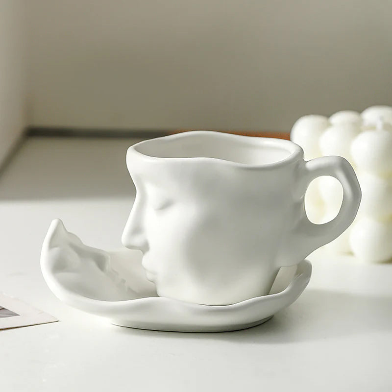 A creative coffee cup in the shape of a ceramic face