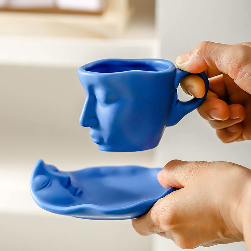 A creative coffee cup in the shape of a ceramic face