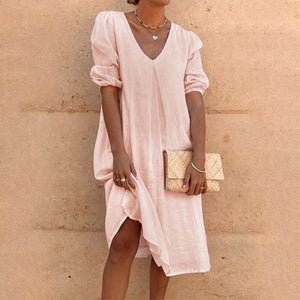 V-neck dress in solid color with lateral sleeves