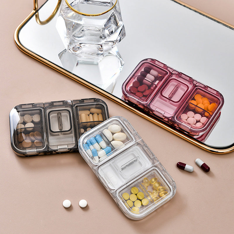 Pill box with a built-in cutter 