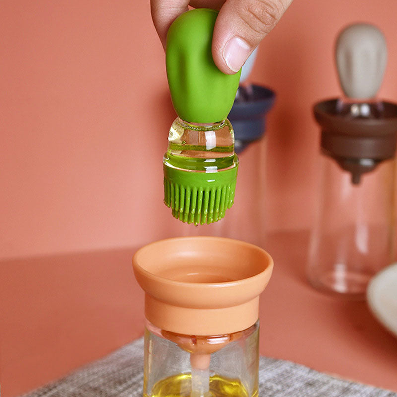 A bottle of kitchen oil with a brush