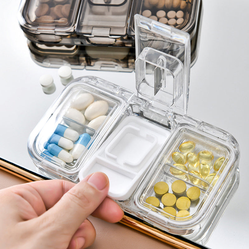 Pill box with a built-in cutter 