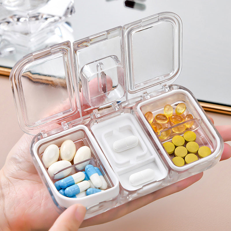 Pill box with a built-in cutter 