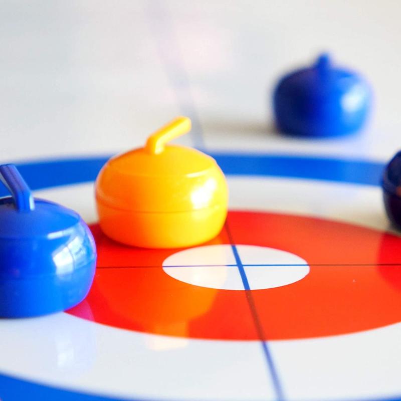 A curling game on a table 