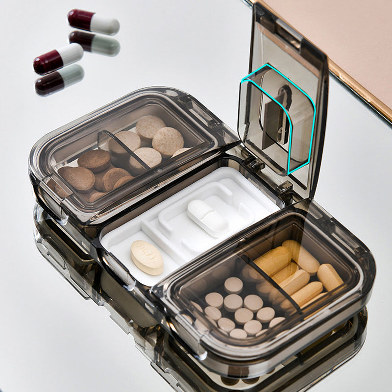 Pill box with a built-in cutter 