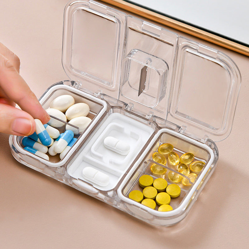 Pill box with a built-in cutter 