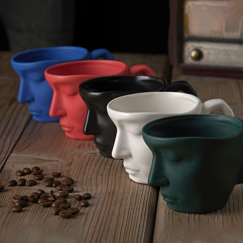 A creative coffee cup in the shape of a ceramic face